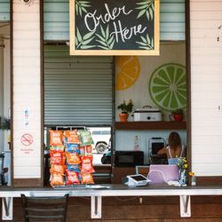 The Squeeze at the Beach - Walk-up ordering window at The Squeeze at the beach. Stop by and order your favorite smoothies, fresh bites, and beach refreshments!
