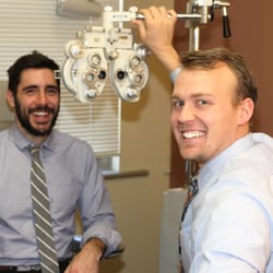 Drs Page and Ward - Dr. Ward working with a patient.