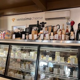 a display of cheese and wine a display of cheese and wine