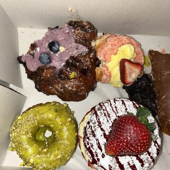 Friendly Donuts - Dipped into the donuts before taking the photo. Oops! That's how good they are, you just can't wait! - Donuts Near Me - Orange, California