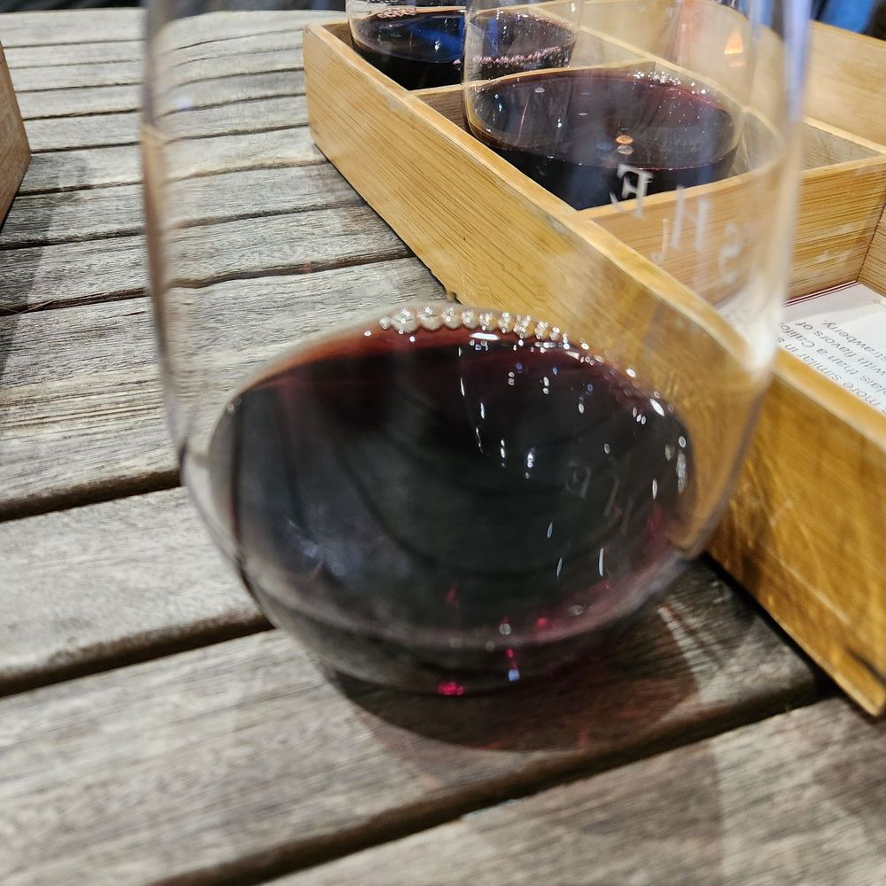 a really good pour of wine tasting a really good pour of wine tasting