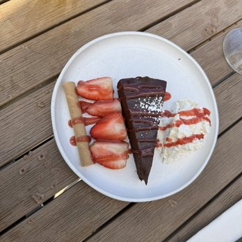 Anton & Michel Restaurant - chocolate torte with homemade whipped cream and strawberries - Modern European Near Me - Carmel, California