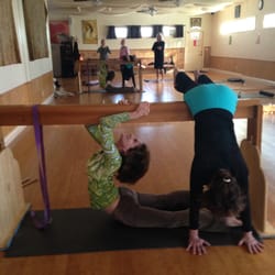 Jacksonville Yoga - Using a Tressler do go deeper into yoga poses!