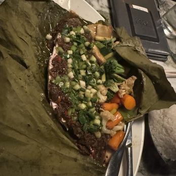 RedFarm - Steamed redfish with vegetables in a lotus leaf - Chinese Near Me - Austin, Texas RedFarm - Steamed redfish with vegetables in a lotus leaf - Chinese Near Me - Austin, Texas