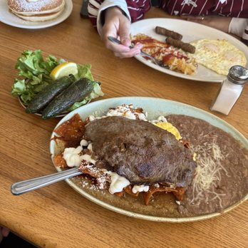 Scrambled - Carne Asada Chillequilles, friend jalepenos + pancake breakfast combo with extra butter and powdered sugar. - Breakfast & Brunch Near Me - Bakersfield, California Scrambled - Carne Asada Chillequilles, friend jalepenos + pancake breakfast combo with extra butter and powdered sugar. - Breakfast & Brunch Near Me - Bakersfield, California