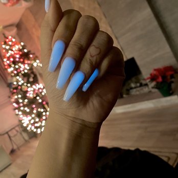 Candy Nails Lounge - What the powder glow in the dark nails look like in darker lighting - Nail Salons Near Me - Riverside, California
