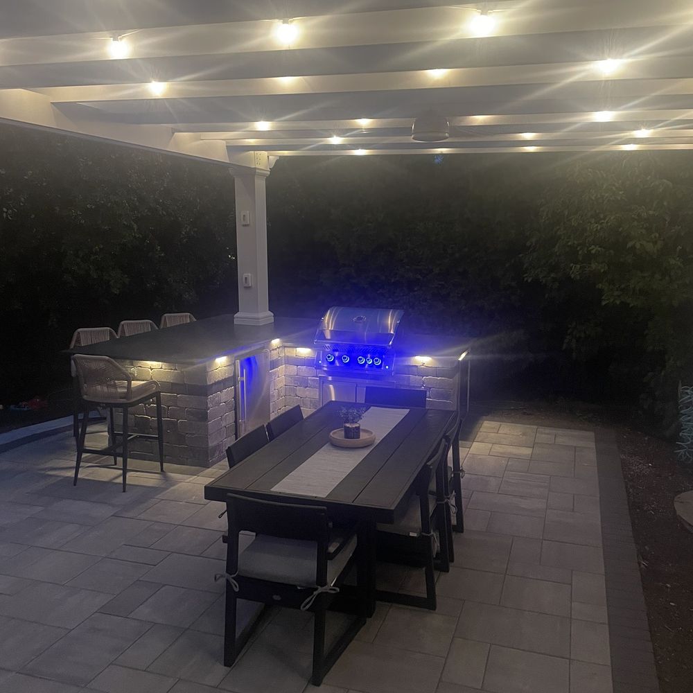 Brick Logik - a patio with a table and chairs - General Contractors Near Me - Aurora, Illinois