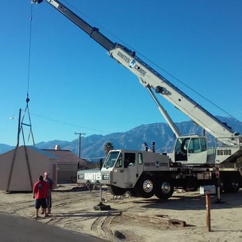 White's Crane Service - Moving a prefab shed with Mt San Jacinto in the background - Crane Services Near Me - Thermal, California White's Crane Service - Moving a prefab shed with Mt San Jacinto in the background - Crane Services Near Me - Thermal, California