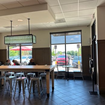 Chick-fil-A - ows people sitting at a table in a restaurant - Fast Food Near Me - Franklin, Tennessee