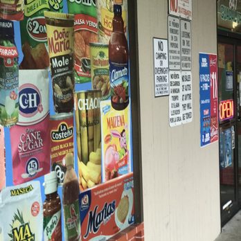 La Tienda De Guadalupe - a woman walking past a store - Grocery Near Me - Gresham, Oregon