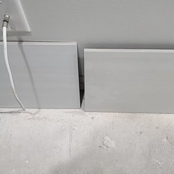 Look closely. The right tile is the correct tone (more yellow) and the left tile is the incorrect tone (brighter, whiter).