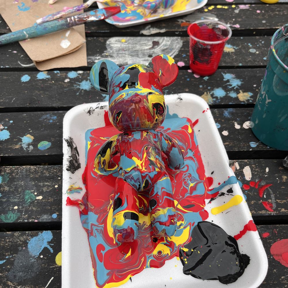 Kolor My Kanvas - My bear in process. Black was my base color and I used red, yellow, and blue for my drip colors - Paint & Sip Near Me - Houston, Texas
