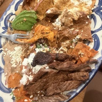Girasol Cocina Mexicana - Chilaquiles Clasicos with added ranchera meat for an extra charge - Mexican Near Me - Monrovia, California Girasol Cocina Mexicana - Chilaquiles Clasicos with added ranchera meat for an extra charge - Mexican Near Me - Monrovia, California