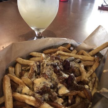 Knub's Pub - Chili cheese fries from the happy hour menu with a margarita - Pubs Near Me - Shawnee, Kansas Knub's Pub - Chili cheese fries from the happy hour menu with a margarita - Pubs Near Me - Shawnee, Kansas
