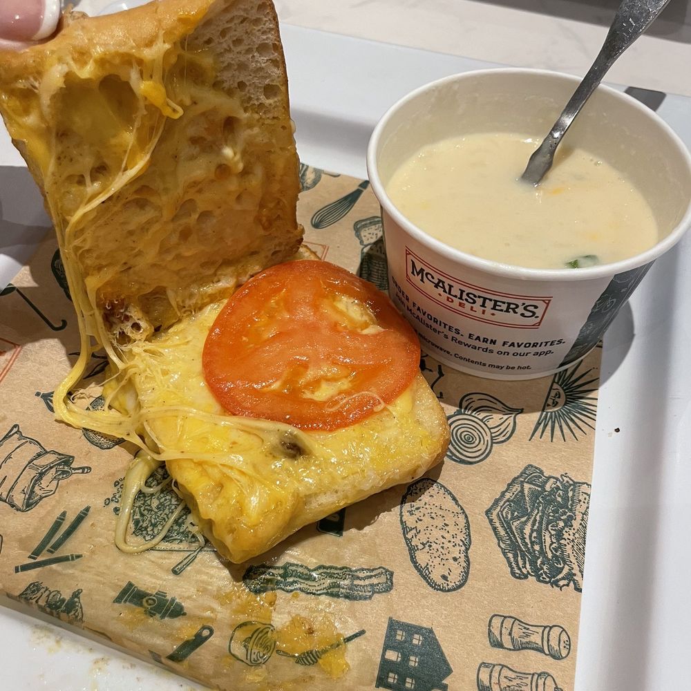 Poor excuse for a four cheese sandwich with tomato