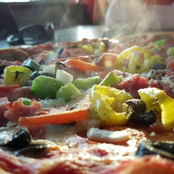 Pepperoni Grill - The JohnnySupremo has 11 topping you can't go wrong with, but 6 pieces isn't enough so order the large - Pizza Near Me - Oak Island, North Carolina