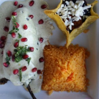 Condesa - Warwick - Stuffed poblano pepper with this crazy walnut sauce sprinkled with pomegranate seeds. Pyramid of rice & black beans - Mexican Near Me - West Warwick, Rhode Island