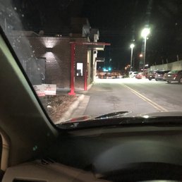 a view of a gas station at night