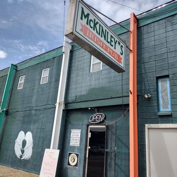 McKinley's Irish Pub - The front entrance. You can't really tell the open sign is lit up because of the sunshine but when the steel door is open the bar is open. - Irish Pub Near Me - Harahan, Louisiana McKinley's Irish Pub - The front entrance. You can't really tell the open sign is lit up because of the sunshine but when the steel door is open the bar is open. - Irish Pub Near Me - Harahan, Louisiana