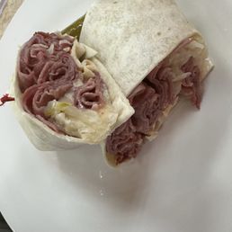 Rueben in a wrap. Hot, kraut and 1000 island dressing as it should be. They need a different side or provide a better quality pickle. Rueben in a wrap. Hot, kraut and 1000 island dressing as it should be. They need a different side or provide a better quality pickle.