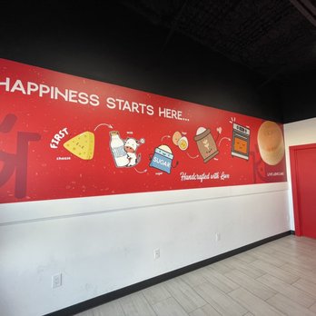 Nikko's Cheesecakes - Cute Wall Decor! Also, bathroom is the right door. - Desserts Near Me - Houston, Texas