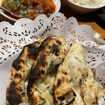 Monsoon Eclectic Modern Indian - The Garlic naan, very comforting and a wonderful compliment to the Vindaloo. - Indian Near Me - Hampton, Virginia