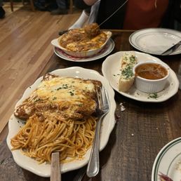 Eggplant parmesan that came with spaghetti; garlic foccacia, and baked ravioli with added meatballs Eggplant parmesan that came with spaghetti; garlic foccacia, and baked ravioli with added meatballs