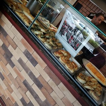 Cafe Dolce Vita - a man standing in front of the counter - Italian Near Me - Deer Park, New York Cafe Dolce Vita - a man standing in front of the counter - Italian Near Me - Deer Park, New York