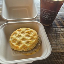 Loaded Hashbrown & Sausage Sandwich and an Iced Americano Loaded Hashbrown & Sausage Sandwich and an Iced Americano