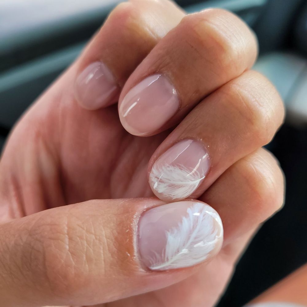 White feathers on pink base by Li.
