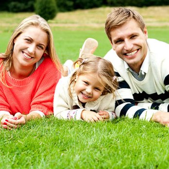 Weed Man - a happy family lying in the grass - Pest Control Near Me - Burlington, Ontario Weed Man - a happy family lying in the grass - Pest Control Near Me - Burlington, Ontario