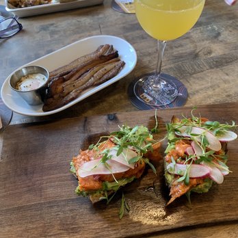 The Brewer's Fork - 'Nduja & Avocado toast with house made bacon and the Dude Bro in the background - Pizza Near Me - Boston, Massachusetts The Brewer's Fork - 'Nduja & Avocado toast with house made bacon and the Dude Bro in the background - Pizza Near Me - Boston, Massachusetts
