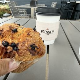 Blueberry muffin and a med roast hot coffee Blueberry muffin and a med roast hot coffee