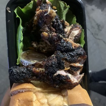 On Pointttt - a hand holding a sandwich with meat and lettuce - Food Trucks Near Me - Downey, California On Pointttt - a hand holding a sandwich with meat and lettuce - Food Trucks Near Me - Downey, California