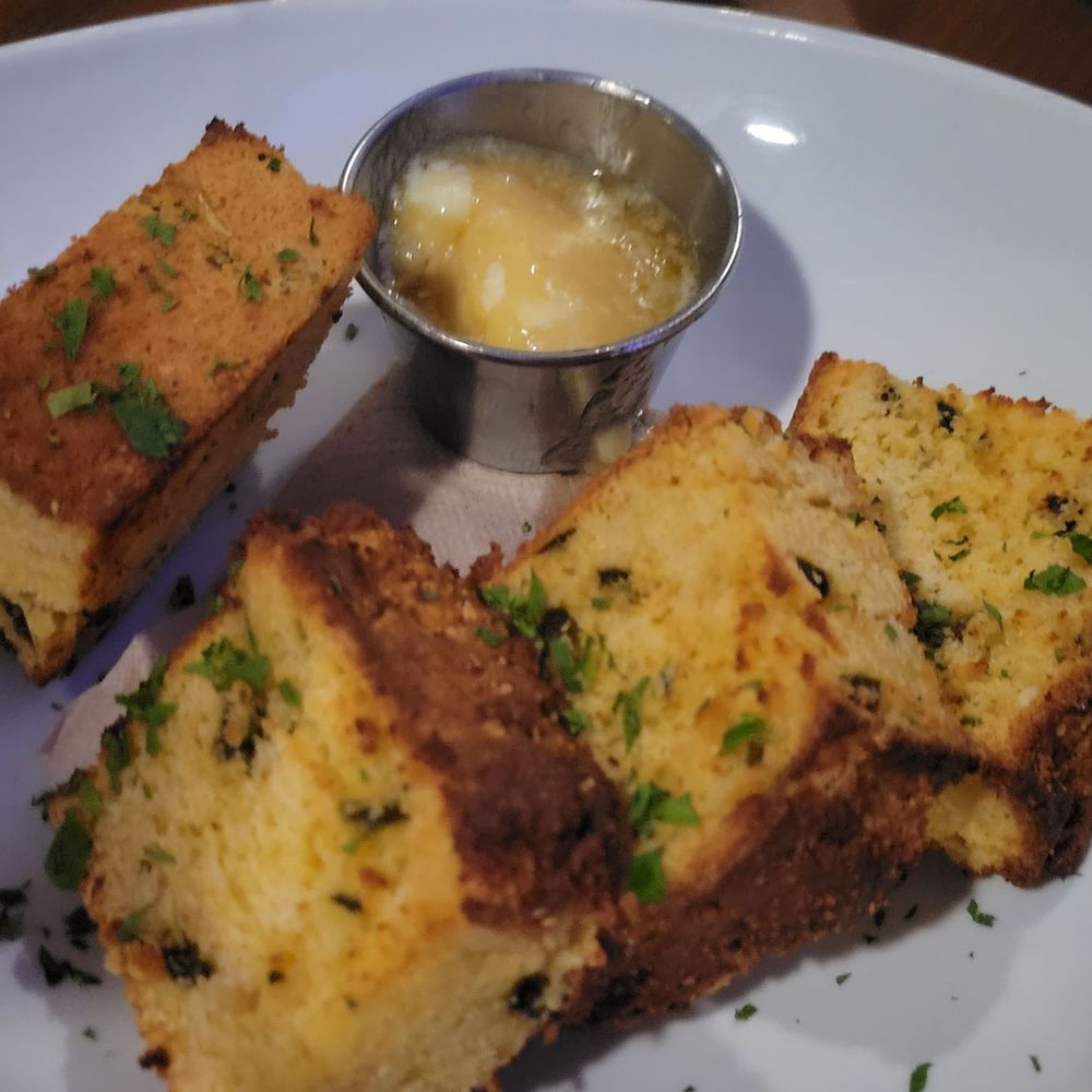 Calypso Edmonds - Jalapeño corn bread and a whipped honey butter spread - Caribbean Near Me - Edmonds, Washington