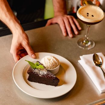 L’Express - Flourless Chocolate Cake with vanilla ice cream - French Near Me - New York, New York L’Express - Flourless Chocolate Cake with vanilla ice cream - French Near Me - New York, New York