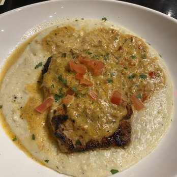 St Augustine Fish Camp - Blackened catch (mahi) with grits. I got the greens on the side - Seafood Near Me - St Augustine, Florida