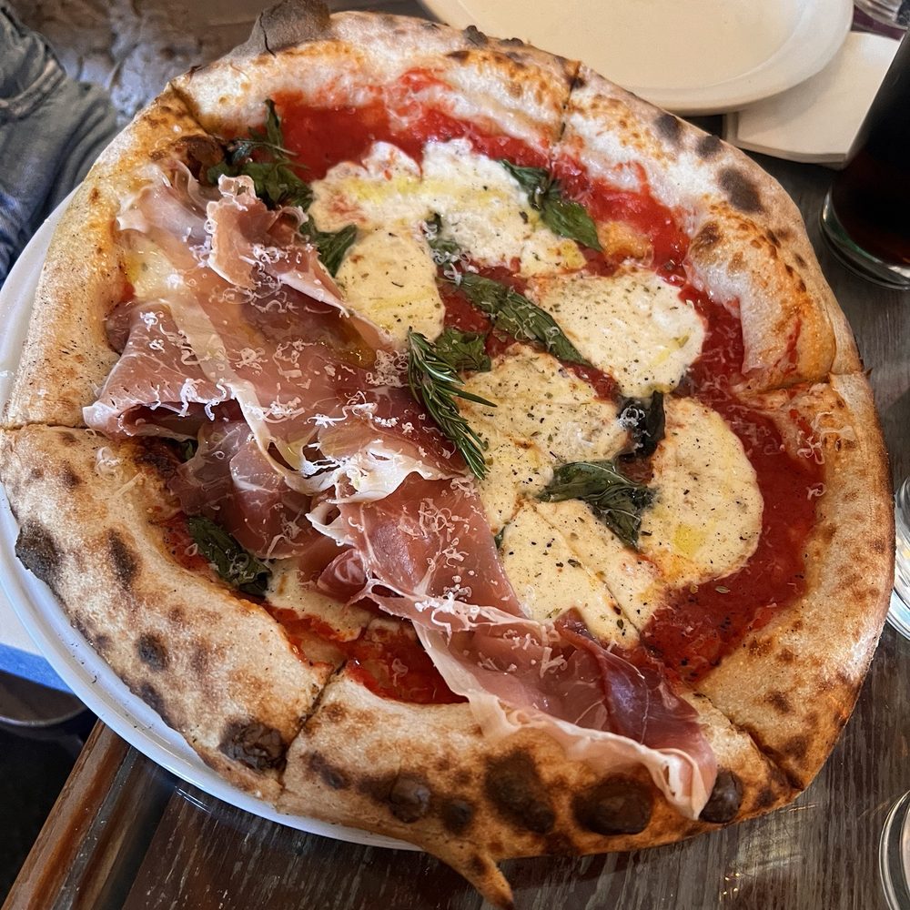 Cafe Reyes - Delicious wood fire pizza-half margherita, half margherita and prosciutto - Pizza Near Me - Point Reyes Station, California Cafe Reyes - Delicious wood fire pizza-half margherita, half margherita and prosciutto - Pizza Near Me - Point Reyes Station, California