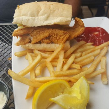 Cornet - Half of the catfish po boy.  Forgot to take a picture before we started eating it. - Cocktail Bars Near Me - New Orleans, Louisiana