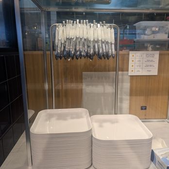 Paris Baguette - Customers use the trays and tongs to select their items. - Coffee & Tea Near Me - Virginia Beach, Virginia