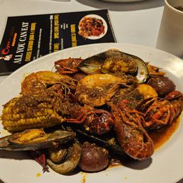 Kuya's style shrimp, crawfish, mussels, clams, potatoes, and corn Kuya's style shrimp, crawfish, mussels, clams, potatoes, and corn