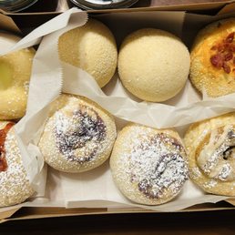 Flavored pandesal, left top - pearl something, plain, bacon and cheddar. Bottom left - strawberry cream cheese, ube and chocolate chip Flavored pandesal, left top - pearl something, plain, bacon and cheddar. Bottom left - strawberry cream cheese, ube and chocolate chip