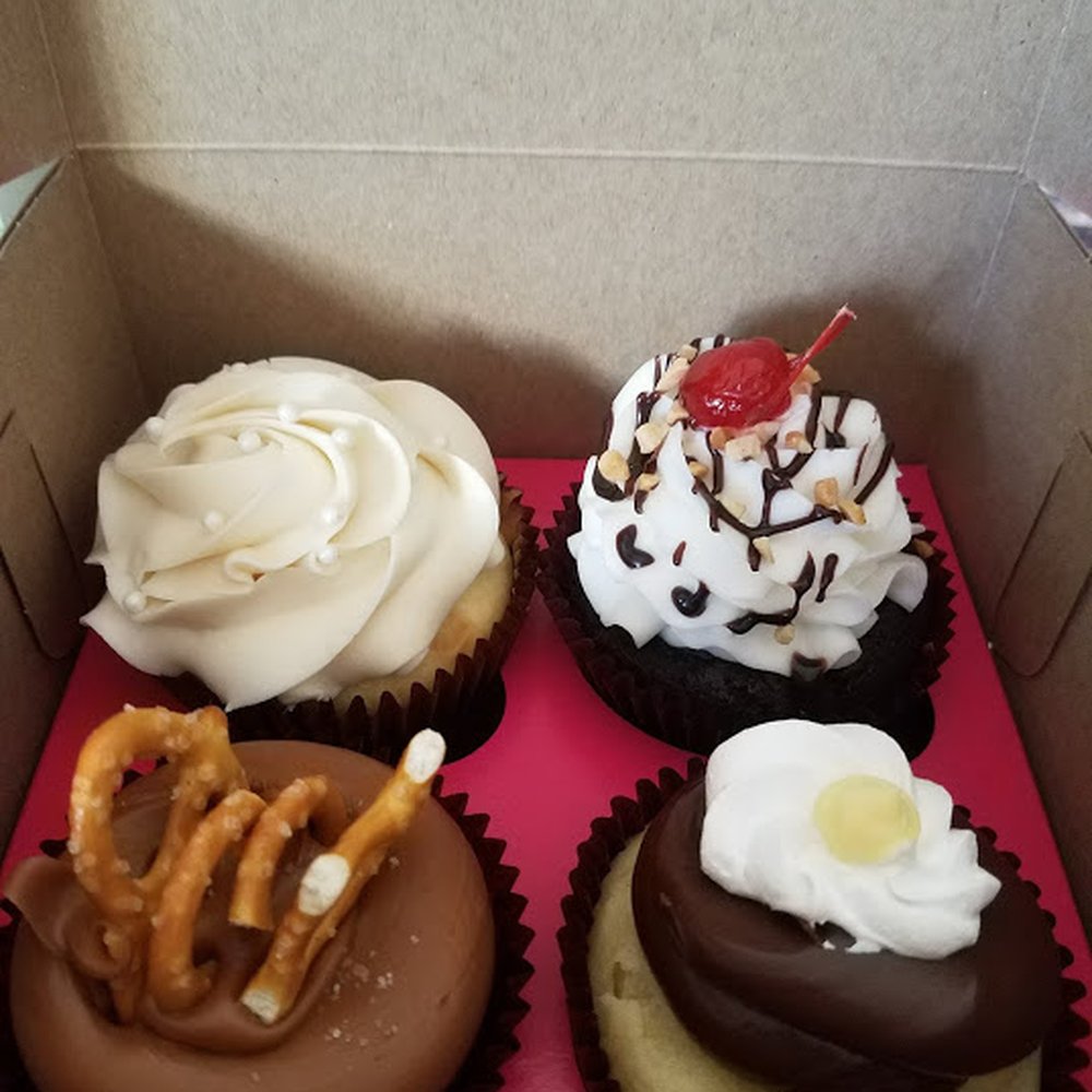 Smallcakes - Upper left is Wedding Cake - Right is Hot Fudge Sunday - Lower Left is Caramel Crunch and Lower Right is Boston Cream Pie - Cupcakes Near Me - Western Springs, Illinois Smallcakes - Upper left is Wedding Cake - Right is Hot Fudge Sunday - Lower Left is Caramel Crunch and Lower Right is Boston Cream Pie - Cupcakes Near Me - Western Springs, Illinois