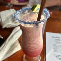 Raspberry frozen margarita with salt rim