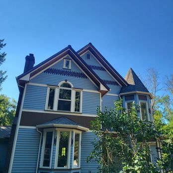 Honest Work - a blue house with a purple trim - General Contractors Near Me Honest Work - a blue house with a purple trim - General Contractors Near Me