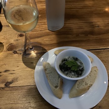 ViV Wine Bistro - Escargot with glass of Sauvignon Blanc - Wine Bars Near Me - Key West, Florida ViV Wine Bistro - Escargot with glass of Sauvignon Blanc - Wine Bars Near Me - Key West, Florida