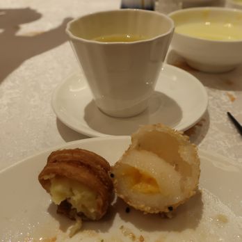 Providential 9 - Contents of a durian pastry and a sesame ball with salty egg yolk. Both were quite nice. - Dim Sum Near Me - Markham, Ontario Providential 9 - Contents of a durian pastry and a sesame ball with salty egg yolk. Both were quite nice. - Dim Sum Near Me - Markham, Ontario