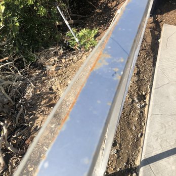 Shields Fence Co. - Rusting metal within the first 30 days without rain. Plexi roughly attached. Screws attaching it are already coming out. - Fences & Gates Near Me Shields Fence Co. - Rusting metal within the first 30 days without rain. Plexi roughly attached. Screws attaching it are already coming out. - Fences & Gates Near Me