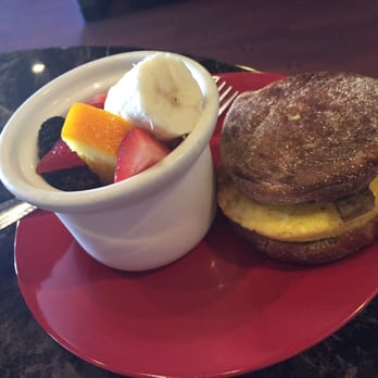 Just Java Coffee - Egg and sausage on English muffin with side of fruit - Coffee & Tea Near Me - Bermuda Dunes, California