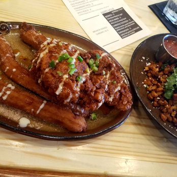 Central Mesa - Chicken and churros on the left, brisket hash on the right! They're both a lot bigger than they look - American Near Me - Tuscaloosa, Alabama